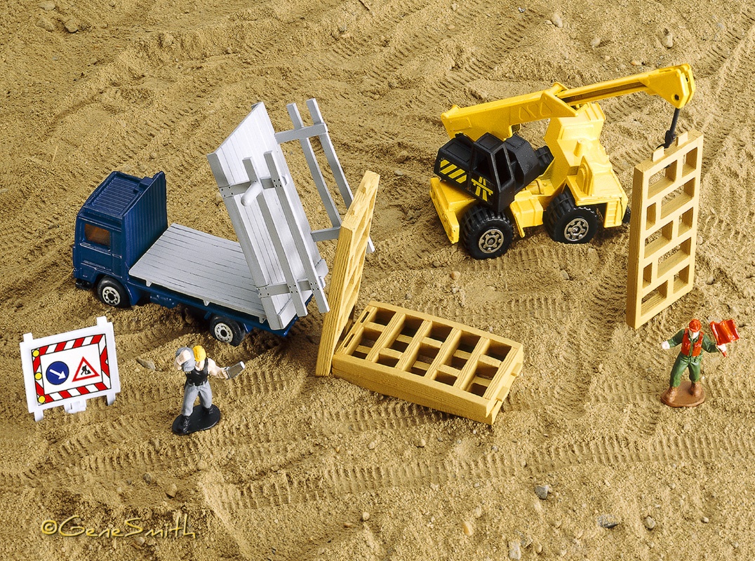 Matchbox toy construction vehicles on playground