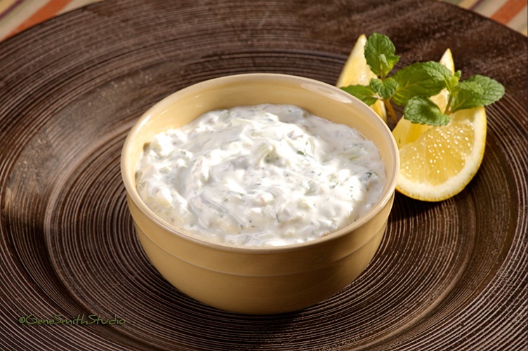 Bowl of Lemon Dip garnished with lemon wedge and mint