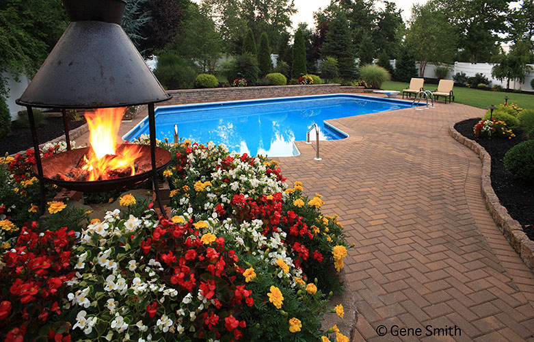 Swimming pool with fire pit and patio