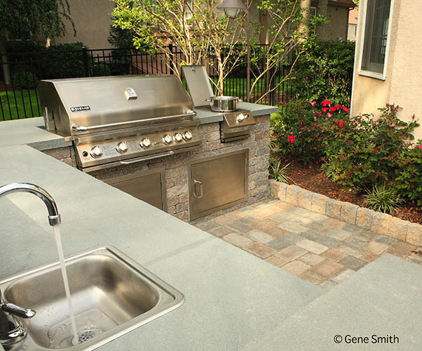 Outdoor patio with kitchen and grill