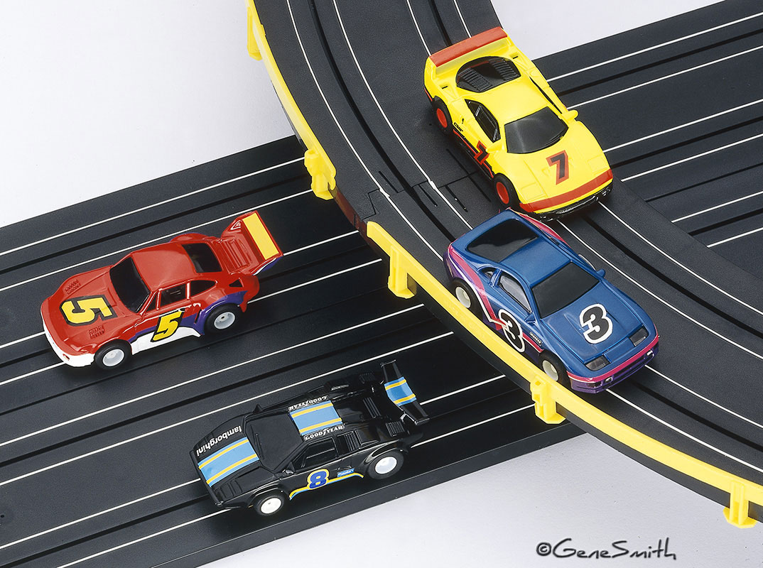 Toy electric slot car racing cars and track