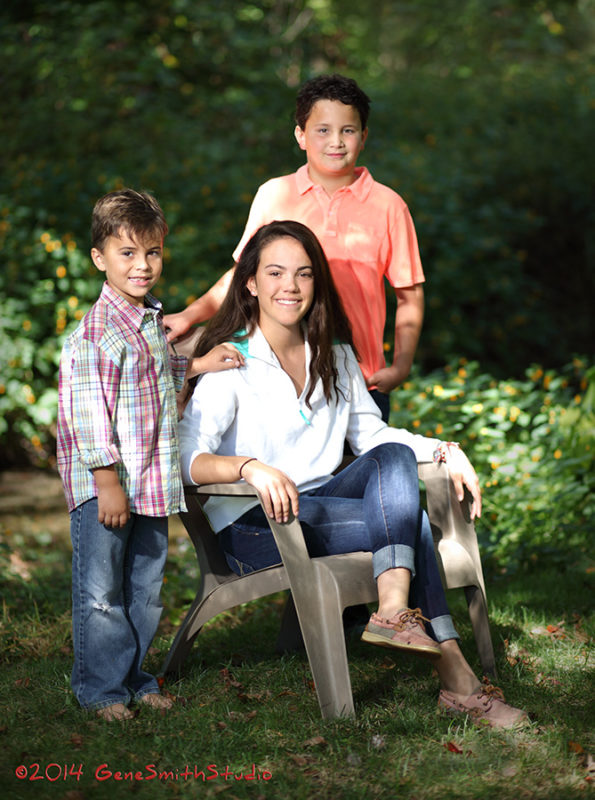 Family portrait of children outdoors.