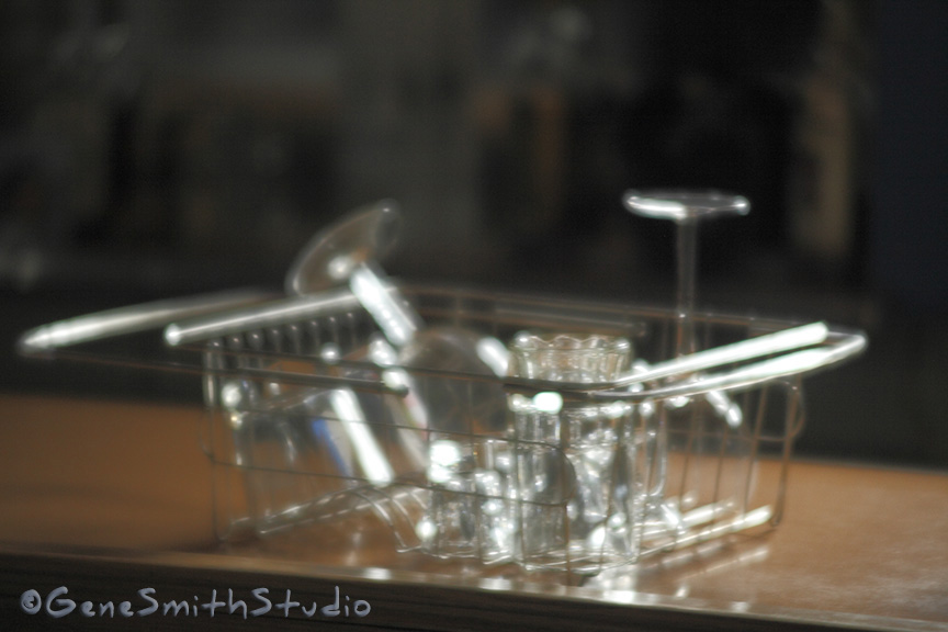 Dish rack with cocktail glasses on bar made with soft focus lens