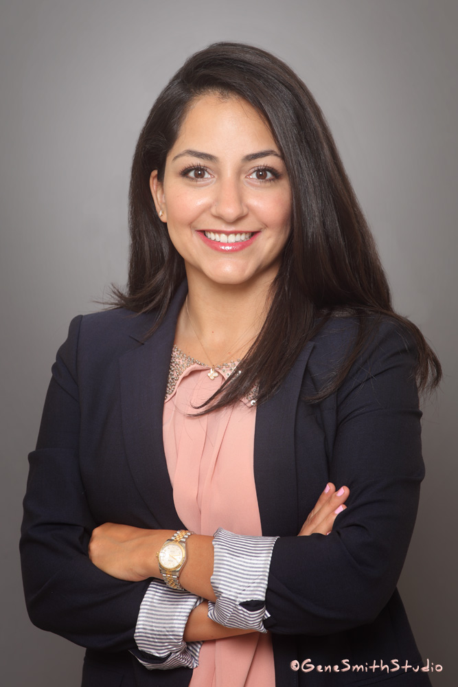 Confident, pretty young female dentist photographed for corporate website by Gene Smith