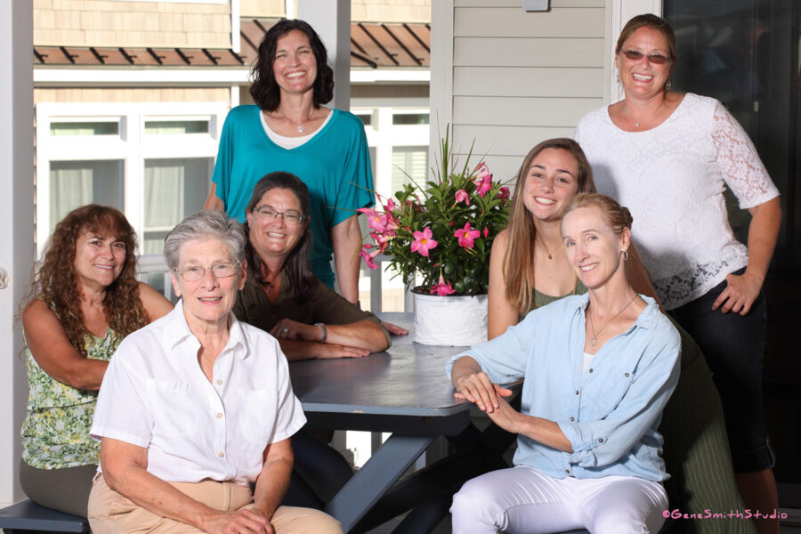 Outdoor family portrait at vacation home at seashore