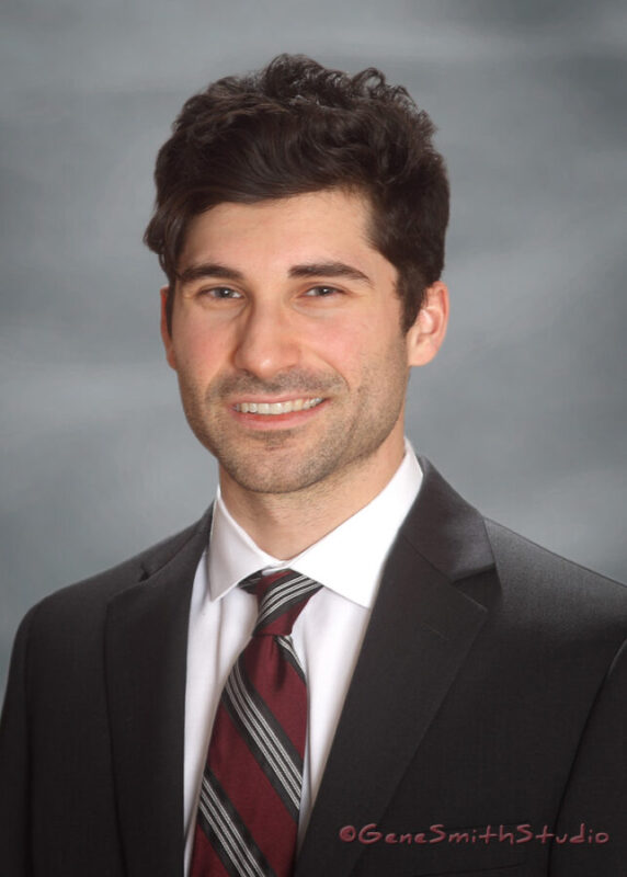 Professional headshot portrait of male executive in white shirt, tie and suit for website, Linkedin and social media.